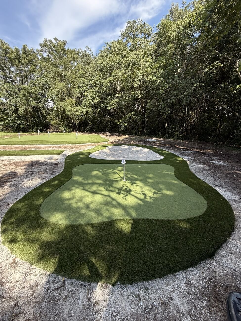 Green grande com bunker de areia e colar de fringe